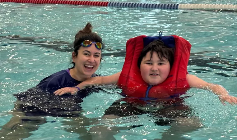 Theo and Ms. Cabral during Healthy Living School's swim