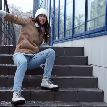 A woman slips on a stair