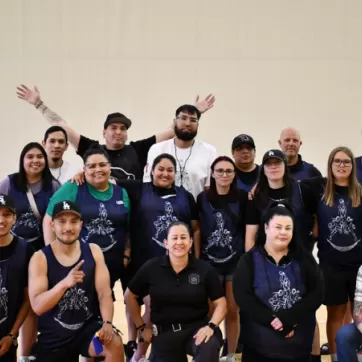 The Indigenous Youth Hoops Tournament committee smiles for a photo