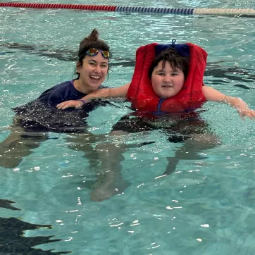 Theo and Ms. Cabral during Healthy Living School's swim